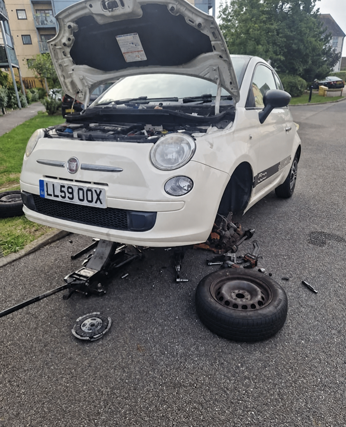 Mobile mechanic carrying out a clutch replacement on a customer's Fiat in Southampton